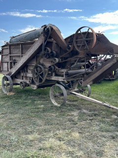 A nice example of an early wooden Mcormick Deering thresher.