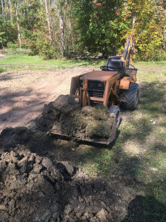644 moving bucket full of sod and dirt