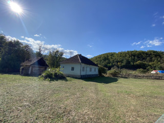 House from the back. Brick construction on stone and cement foundation. Ceramic tiles roof.