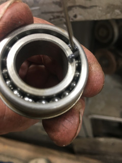 Needle fits between bearing balls