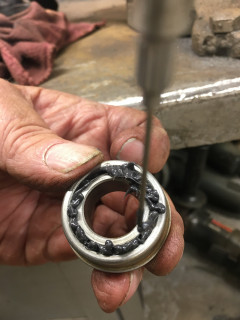 Needle greasing bearings