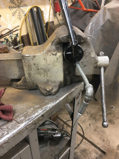 Grease gun mounted in vise