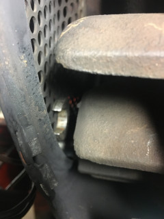 Wrench between flywheel and blower screen.