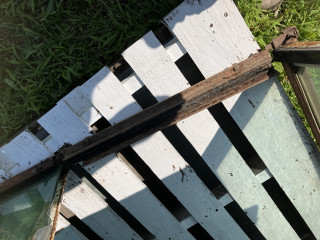 Window track hinges to allow entry into cab.