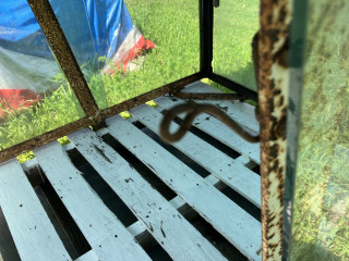 Hook on door fame to hang window track.