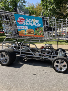 Driver sits up where the kids would sit, but facing forward.