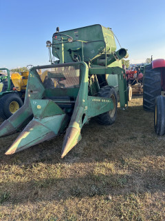 Here a John Deere 40 series combine with a two row corn head and open station. Quite antiquated by today’s standards, but what a technological leap for its day!