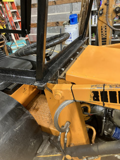 Bracket mounted on front of tractor