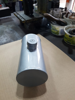 End caps were cut out and edge rolled over a plate locked in the lathe . sheet metal was pinched between two plates to hold while rolling the edge with knurling tool