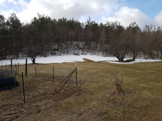 southwest corner in the shadow of the hillside still with some snow