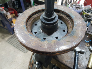 Old rotor used for spacer on hub tamer