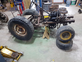 this is the oldest of the 2 tractors with the modern wheels my grandfather put on to use it in his garden . this is the way I remember seeing it when I was young