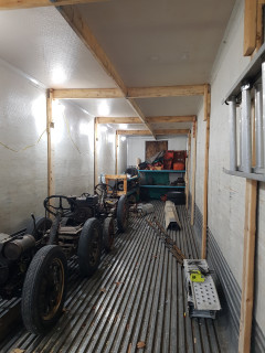 a little over 8 feet wide on inside , lots of room to hang stuff on the braces .