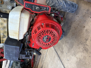 Reassembled Honda engine covers after cleaning dirt in cylinder fins. Checked timing and set valve lash