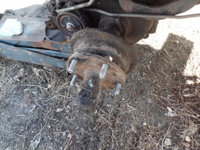 Removing the collar with 2 set screws let me pull this hub from the differential to get the studs in.