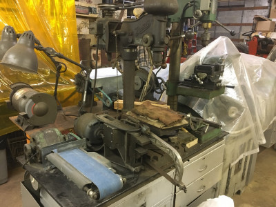 Two drill presses, belt sander and power hack saw.