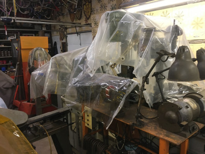 Machines are usually covered up with old used shower curtains to keep the dust off.