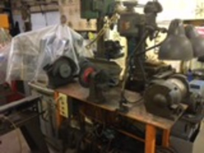 Bench grinder, motorized wire wheel and honing wheel.