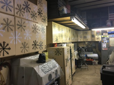 Cabinets galore. Bead blaster and air compressor in corner.