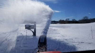 You can see the snow coming out every time the impeller rotates.