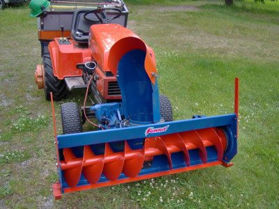 Ariens tractor with what looks like an Ingersoll blower. Appears to have a straight section welded on before the typical Ingersoll chute. Also take note of the quart jug that appears to be hiding the chute rotation motor.