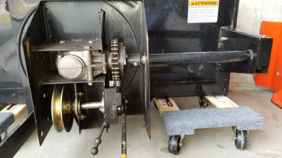 The Berco's drive system. That's a right angle gear box on the top left to drive the impeller. The large sprocket in the top center connects to two different drive shafts with shear bolts. The right shaft connects to a second chain drive for the auger (next to my snowcaster).