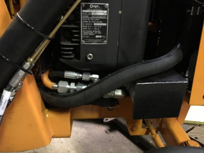 Fabricated bracket and cover around filter to protect it