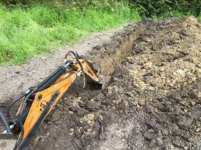 Digging a trench 3' deep and 30' long