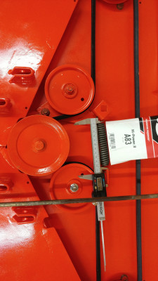 Closeup. Tensioner spring is stretched 4.565". The added pulley may be a little too close to the center drives spindle?