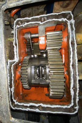 Beads on the edges of the gearbox top surface, about 1/8 thick.