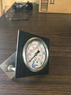 Gauge assembled in bracket