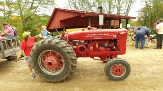 This tractor transports people around the show